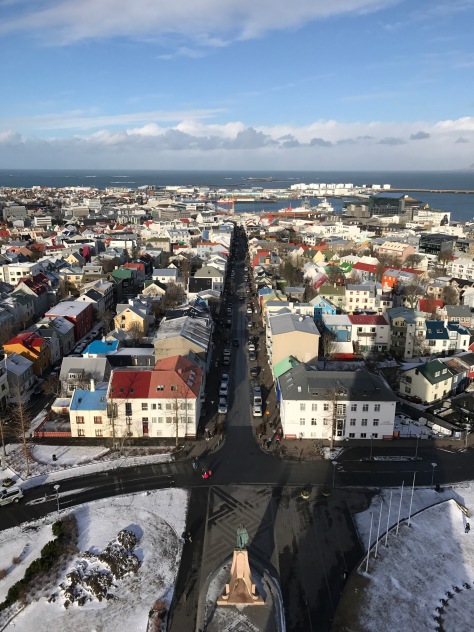 Reykjavik from the bell tower of Hallgrimskirkja Church with the statue of Leif Eiriksson below