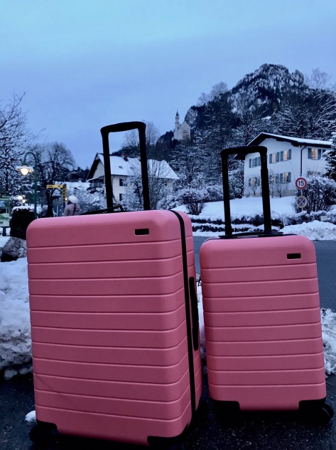 My Away luggage with Neuschwanstein Castle on the mountain 